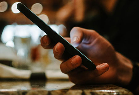Donor receiving a text on their phone from texting software for nonprofits
