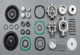 AODD pump spare parts laid out — diaphragms, check balls, seats, gaskets and air valve components